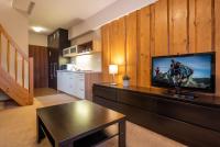 Televízia a/alebo spoločenská miestnosť v ubytovaní Via Jasna Wellness Apartments