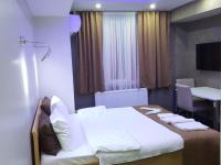 A bed or beds in a room at KILIÇ MOTEL