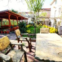 A garden outside KILIÇ MOTEL