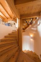 a wooden staircase in a house with wooden floors at Das Kitz - deLuxe Chalet Valerie in Reith bei Kitzbühel