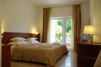Łóżko lub łóżka w pokoju w obiekcie Hotel Villa Vera