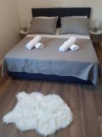 Posteľ alebo postele v izbe v ubytovaní Apartman Bella 1