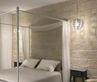 Postel nebo postele na pokoji v ubytování Eco Life Stone Villa