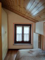 A bed or beds in a room at B&B La Casetta