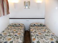 Postel nebo postele na pokoji v ubytování JARDINS DEL MAR 138