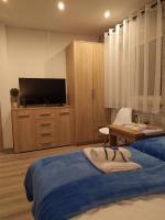 Televízia a/alebo spoločenská miestnosť v ubytovaní Apartament KAOLA