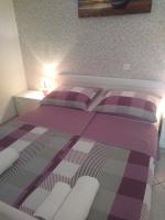 Postel nebo postele na pokoji v ubytování Apartments Soljacic