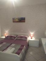 Postel nebo postele na pokoji v ubytování Apartments Soljacic
