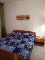 Postel nebo postele na pokoji v ubytování Apartments Soljacic