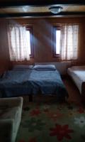 Postel nebo postele na pokoji v ubytování Guest House Leona