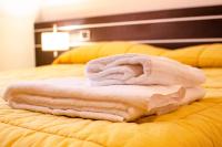 A bed or beds in a room at Al Fogolâr Rooms & Osteria with Saunaland
