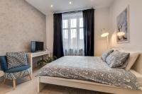 Posteľ alebo postele v izbe v ubytovaní KATO Apartamenty Centrum
