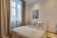 Posteľ alebo postele v izbe v ubytovaní KATO Apartamenty Centrum