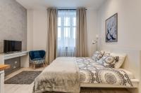Posteľ alebo postele v izbe v ubytovaní KATO Apartamenty Centrum