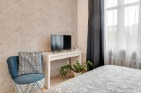 Televízia a/alebo spoločenská miestnosť v ubytovaní KATO Apartamenty Centrum