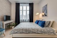 Posteľ alebo postele v izbe v ubytovaní KATO Apartamenty Centrum