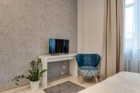 Televízia a/alebo spoločenská miestnosť v ubytovaní KATO Apartamenty Centrum
