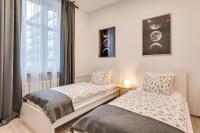Posteľ alebo postele v izbe v ubytovaní KATO Apartamenty Centrum