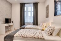 Posteľ alebo postele v izbe v ubytovaní KATO Apartamenty Centrum