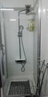 a shower with a glass door in a bathroom at Apartment M&amp;A in Osijek