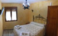 Postel nebo postele na pokoji v ubytování La Casita del Guarda