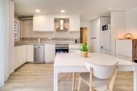 A kitchen or kitchenette at Hauzify I Apartament Rosa dels Vents