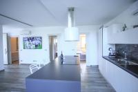A kitchen or kitchenette at T Villa