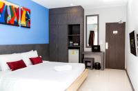 Postel nebo postele na pokoji v ubytování FX Hotel Pattaya