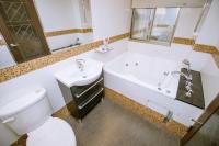 a bathroom with a toilet and a sink and a tub at Guide Hotel Taipei Xinyi in Taipei