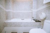a bathroom with a toilet and a bath tub at Guide Hotel Taipei Xinyi in Taipei