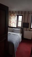 Postel nebo postele na pokoji v ubytování Hotelik & Restauracja Złota Kaczka