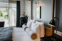 Postel nebo postele na pokoji v ubytování Nimb Hotel