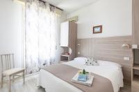 Łóżko lub łóżka w pokoju w obiekcie Hotel Verde Luna