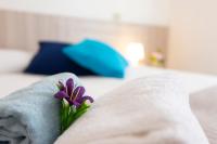 Łóżko lub łóżka w pokoju w obiekcie Hotel Verde Luna