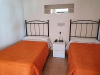 Posteľ alebo postele v izbe v ubytovaní Apartamentos Mediterraneo