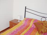Łóżko lub łóżka w pokoju w obiekcie Casa Amalia