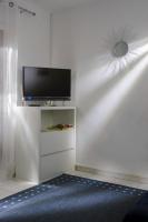 Televízia a/alebo spoločenská miestnosť v ubytovaní Apartments IDa II