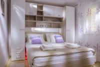 Posteľ alebo postele v izbe v ubytovaní Apartments IDa II