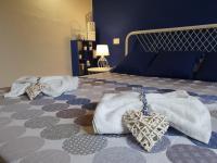 A bed or beds in a room at Spazioso appartamento con terrazza a due passi dal centro