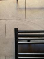 a bench sitting on the side of a sidewalk at Hotelski in Verbier