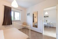 Posteľ alebo postele v izbe v ubytovaní Apartments Laura
