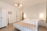 Postel nebo postele na pokoji v ubytování Apartments Morozin