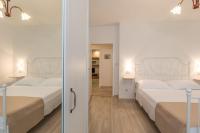 Postel nebo postele na pokoji v ubytování Apartments Morozin