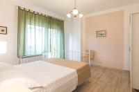 Postel nebo postele na pokoji v ubytování Apartments Morozin