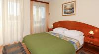 Postel nebo postele na pokoji v ubytování Apartment & Room Angerona