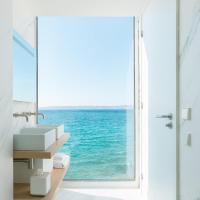 a bathroom with a view of the ocean through a window at Les Bords De Mer in Marseille