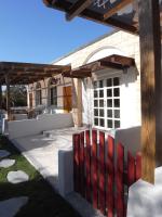 a patio with a red bench under a pergola at Sheep House B&amp;B in Ji&#39;an