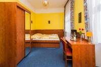 Postel nebo postele na pokoji v ubytování Hotel Morava