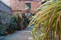 A garden outside Palazzo Velli Suites
