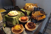 a buffet with bowls of food on a table at Embassy Quito in Quito